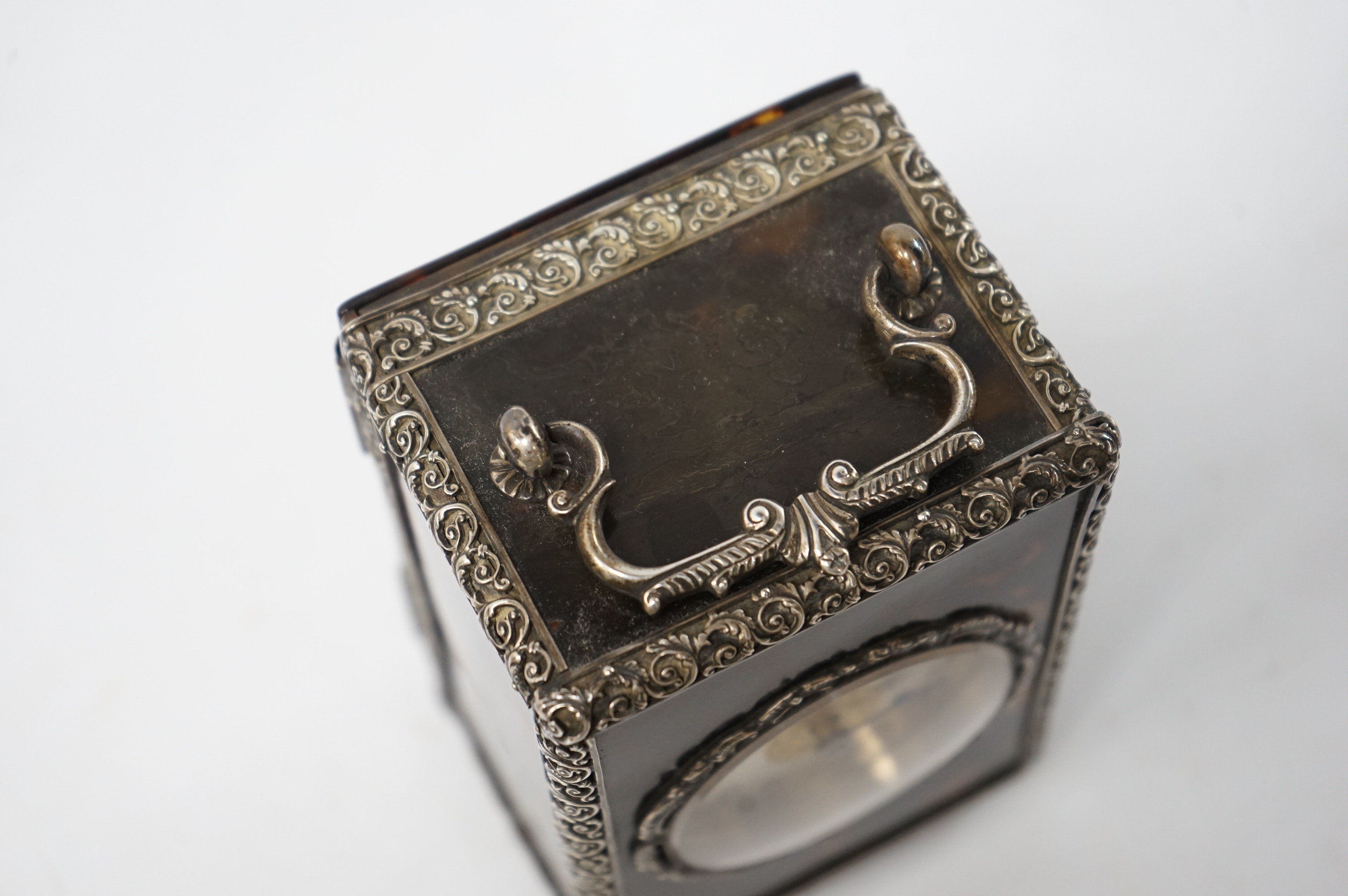 A late 19th century French tortoiseshell carriage clock, with white metal mounts, 15cm high. Condition - good, untested but currently ticking